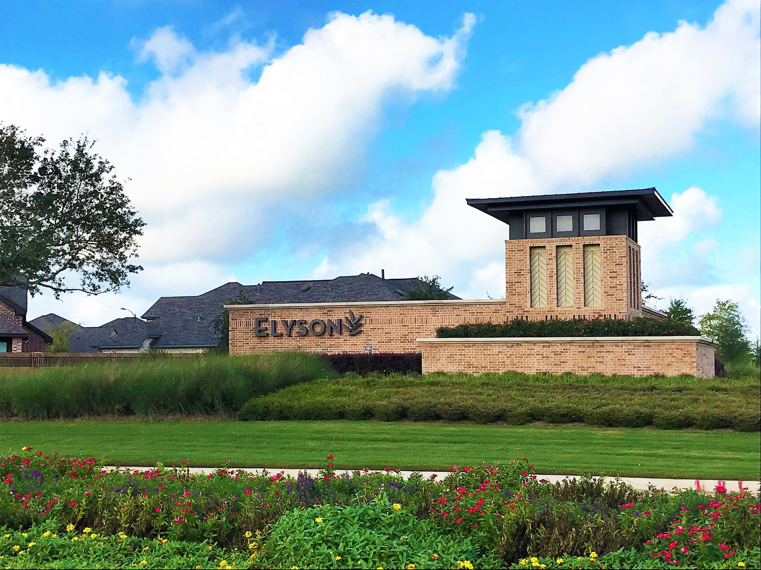 An entry monument marks the entrance to the Elyson masterplanned community.